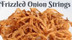 fried onion strings on a white plate with the words frizzled onion strings