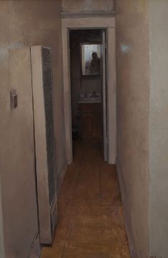 an empty hallway leading to the bathroom