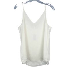 Nwt Express Women's Ivory V-Neck Tank Top Spaghetti Straps Size Medium New With Tags. Light Spots Along The Interior Neckline. Measurements: Pit To Pit: 19.25" Length: 25.5" White V-neck Tank Top With Delicate Straps, White V-neck Camisole With Delicate Straps, Elegant Summer V-neck Camisole, Elegant V-neck Tank Top For Brunch, White Camisole With Built-in Bra For Night Out, Spring Cream Tank Top With Built-in Bra, Chic V-neck Camisole For Day Out, White V-neck Tank Top For Brunch, Spring V-neck Camisole With Delicate Straps