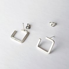 A pair of minimalist silver stud earrings, uniquely handcrafted using traditional silversmithing techniques in my London workshop. All custom to your taste, they can take up to 2 business days to be dispatched.  ‣‣ Clean design ideal for an everyday look ‣‣ Fully handmade one-of-a-kind treat for yourself or your loved ones ‣‣ Gift boxed with a personalised message card ‣‣ Free, fast, and secure delivery  ‣‣ 13% OFF with this coupon (excluding Sale items):  https://www.etsy.com/uk/shop/AndyKashtanJewellery?coupon=1STPURCHASE MORE DETAILS: These unique contemporary stud earrings are made by hand from high-quality recycled sterling silver square wire using traditional silversmithing techniques in my London studio. A square is shaped and soldered to the pin. After that, the components are then Minimalist Hallmarked White Gold Earrings, Minimalist Everyday Earrings, Minimalist Everyday Hallmarked Earrings, Silver Minimalist Hallmarked Earrings, Minimalist Silver Earrings For Gift, Silver Hallmarked Minimalist Earrings, Modern Sterling Silver Earrings As Gift, Everyday Minimalist 925 Stamped Earrings, Everyday Minimalist Stamped 925 Earrings