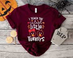 "DESCRIPTION! One Thankful Teacher Shirt, Thankful Teacher Pumpkin Shirt,Thanksgiving messy bun Shirt,Family Thanksgiving Shirt,Thanksgiving Dinner Shirt -Personalization box is only for design color information. - This design will be made with heat press vinyl. - Backside design is additional fee, please make sure to add the fee into your purchase. - If you want to add or change anything on the existing design that we show in the display picture, please contact with the seller from message box Teacher Thanksgiving, Teachers Thanksgiving, Amber Price, Turkey Shirts, Thanksgiving Svg, Silhouette Vinyl, Thanksgiving Shirt, Pumpkin Shirt, Teacher Outfits