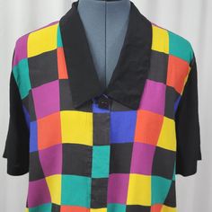 Spice up your wardrobe with this vintage Bedford Fair multicolored block blouse! Perfect for a rockabilly look, this rayon blouse in size 10 is a stylish addition to any outfit. Don't miss out on this 1990s treasure! #vintagefashion #bedfordfair #multicolorblouse #rockabillystyle #90sfashion 🌸💃🏻👚 Multicolor Collared Blouse For Spring, Spring Multicolor Collared Blouse, Multicolor Short Sleeve Tops With Colorful Pattern, Multicolor Short Sleeve Top With Colorful Pattern, Retro Tops With Colorful Pattern For Fall, Retro Colorful Patterned Tops For Fall, Spring Workwear Blouse With Color Block, Trendy Short Sleeve Blouse With Colorful Pattern, Spring Blouse With Colorful Pattern And Short Sleeves