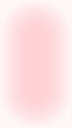 a white and pink background with an oval shape in the center that is slightly blurry