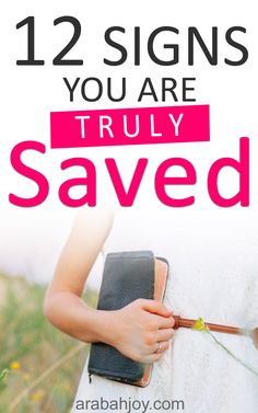 a woman holding a book with the title 12 signs you are truly saved