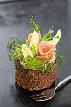 there is a fork on the table with some food in it's centerpiece