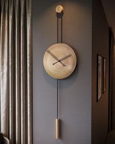 a clock mounted to the side of a wall