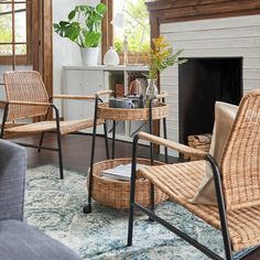 a living room with wicker furniture and a fireplace