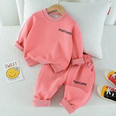 Experience pure comfort with our Postcard Smile Sweatshirt and Sweatpants Set. Perfect for girls and boys, this set comes in two stylish color options, pink and gray. Made with a soft blend of 60% cotton and 40% polyester, this outfit is perfect for lounging or casual wear. Spread smiles everywhere you go with this cozy and quirky set! Top Skirt Set, Sweatpants Set, Boys Set, Formal Suits, Boys Hoodies, Elastic Waist Pants, Girl Sweatshirts, Formal Outfit, Matching Dresses