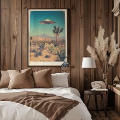 a bedroom with wood paneling and a painting on the wall next to a bed