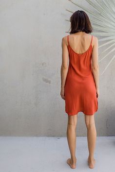 The IDIS silky slip dress is made from 100% silk crepe, has a wide scoop neck line and side splits - cut on the bias to fall just right. Can be worn as a dress or tucked into pants as a silk cami. Clothing that moves and evolves with you. Bringing you comfort and movability while maintaining a simple elegance. SIZE GUIDE XS: bust 76-82 cm | waist 64-70 cm | hips 78-84 cmS: bust 82-84 cm | waist 70-76 cm | hips 84-90 cmM: bust 84-88 cm | waist 76-82 cm | hips 90-96 cmL: bust 94-100 cm | waist 82- Coral Silk Slip Dress, Cheap Slip Dress For Beach, Cheap Women's Slip Dress For The Beach, Luxury Red Silk Slip Dress, Red Slip Dress Casual, Affordable Sundress Slip Dress For Vacation, Cheap Summer Sundress Slip Dress, Cheap Spring Sundress Slip Dress, Cheap Fitted Slip Dress For Beach