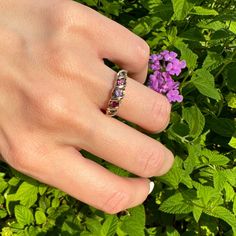 Vintage 9k Swirl Ring Stacker (Natural amethyst, garnet and iolite) Ring          Description:     Vintage 9k Swirl Ring Stacker (Natural Amethyst, Garnet and Iolite) Ring 1 Amethyst, 2 Garnet, 2 Iolite English Hallmarks Size:5 3/4 (almost a 6) 2.02g          Details:               Material: Please refer to product specifics for details          Design: Unique and elegant          Style: Versatile, perfect for any occasion          Perfect for: Everyday wear, special occasions, gifts          Price: $265.0               Why You'll Love It:               Timeless Design: Adds a touch of elegance and sophistication to your look.          High-Quality Craftsmanship: Ensures durability and timeless appeal.          Versatile Style: Perfect for both everyday wear and special occasions, making i Heirloom Amethyst Birthstone Ring, Heirloom Amethyst Ring With Accent Stones, Heirloom Purple Sapphire Ring For Anniversary, Purple Sapphire Ring With Rose Cut Diamonds As Gift, Gift Purple Sapphire Ring With Rose Cut Diamonds, Heirloom Multi-stone Amethyst Ring, Purple Amethyst Ring With Rose Cut Diamonds, Heirloom Purple Ring With Rose Cut Diamonds, Purple Rose Cut Diamond Ring As A Gift