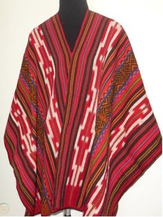 "This poncho is hand woven in the traditional Andean method \"Aguayo\" This poncho will fit people size ranging medium to large. AGUAYO: Is a naturally dyed blend of alpaca, llama and sheep wool , hand woven in the Andean village of Peru called Paucartambo by the Q'eros community. Culture: Quechua Material: Alpaca blend Measurements: 68 X 48 inches (172cm x 122cm)" Traditional Multicolor Cape For Fall, Traditional Handwoven Poncho For Fall, Traditional Red Shawl, Traditional Handwoven Poncho In Shawl Style, Traditional Red Poncho For Fall, Traditional One Size Woven Poncho, Traditional Shawl Poncho One Size, Traditional Red Poncho For Festivals, Red Folk Style Poncho For Festival