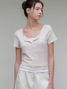 This is a minimal and feminine top by ourcomos that is made out of high quality and sturdy material. With distinctive mood of the design and comfortable wear, you can use it for your daily lifestyle.- Knit-like boucle fabric with soft touch- Slim fit with elasticity- Four button cosure on neckline Cream Knit Tops With Soft Texture, Casual Summer Tops With Soft Texture, Chic Crew Neck Top With Soft Texture, Relaxed Fit Knit Tops With Soft Texture, Cream Knit Top, Chic Tops With Soft Texture And Relaxed Fit, Cream Tops With Soft Texture For Layering, Everyday Cream V-neck Top, Simple Beige Top For Everyday