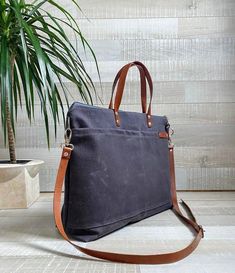 "UNISEX WAXED CANVAS BAG | for women or men This Top seller Weekender tote is not super large & big but it does handy to carry around and does the job to store your essentials in order. Measurements: ( It can be made in other sizes too, please contact me ) ~17 1/2 \" across the opening (45 cm), ~11 1/2\" H (30 cm) ~4.5 \" D (12 cm) Double strap : 14 1/2\" (37 cm) Removable strap : from 27\" to 50\" (68cm to 127 cm) FEATURES: The fully waxed canvas wears like leather; it will age beautifully. Black Cotton Weekender Bag For Everyday Use, Practical Bags With Laptop Sleeve For Everyday Use, Everyday Waxed Canvas Shoulder Bag With Top Carry Handle, Large Canvas Bag With Reinforced Handles For Everyday Use, Everyday Waxed Canvas Shoulder Bag With Top Handle, Everyday Canvas Bag With Reinforced Handles, Waxed Canvas Briefcase For Everyday Use, Everyday Waxed Canvas Shoulder Bag With Reinforced Handles, Everyday Shoulder Bag With Reinforced Waxed Canvas