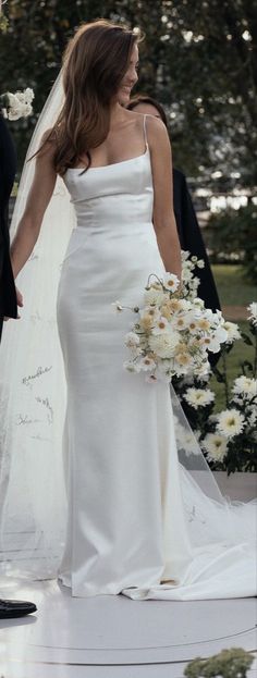 the bride and groom are walking down the aisle