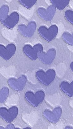 purple and white hearts are arranged in the shape of heart shapes on an abstract background