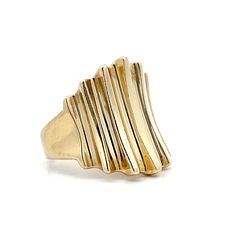 Get ready to make a statement with this stunning modern cocktail ring! Crafted in 14 karat yellow gold, this ring features a sleek, high polished finish that catches the light with every movement. The ridged gold band tapers in size from the center of the ring, creating a unique and eye-pleasing design. Whether you're dressing up for a night out or adding some flair to your everyday look, this ring is the perfect accessory. Its modern design and timeless elegance make it a must-have addition to Contemporary 14k Yellow Gold Rings, Modern Yellow Gold Wide Band Ring For Formal Occasions, Modern Formal Wide Band Ring In Yellow Gold, Modern 14k Gold Bypass Ring For Formal Occasions, Modern 14k Gold Wide Band Ring, Modern Formal Rings With Fluted Bezel, Modern 14k Gold Dome Ring, Modern Cocktail, Gold Band