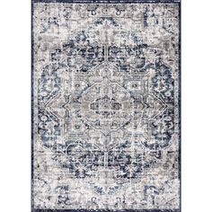 a blue and white rug with an ornate design