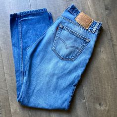 A Gorgeous Faded Blue Wash Vintage 501 Levi’s From 2000. There Is Some Fading Across The Thighs That Give It A Soft, Worn In Look. There Is A Small Stain Near The Back Pockets, But I Think It Adds To The Vintage Charm. Can Fit A Modern Size 28-30 Depending On Desired Fit. I Wear A 28/29 And These Are A Loose Relaxed Fit On Me. See Approximate Measurements. W 16.5 R 11.5 I 30 Classic Blue Levi's Jeans, Vintage 501, Vintage Levis 501, 501 Jeans, Levi’s 501, Levi Jeans 501, Levis 501, Vintage Levis, Levis Jeans