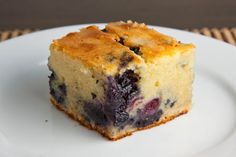 a piece of blueberry cake on a white plate