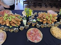 a table with many different types of food on it