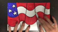 someone is drawing an american flag with colored pencils