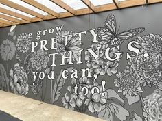 a mural painted on the side of a building that says grow pretty things you can't do