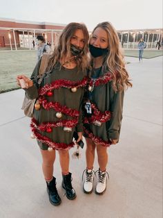 two girls wearing face masks standing next to each other