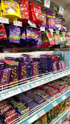 an aisle in a grocery store filled with lots of candy