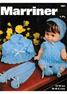 an image of a baby doll in blue crochet outfit and bonnet with matching booties