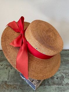 Rare vintage Italian 1920s Women's Straw Boater with Original Peach Silk Ribbon by G. Golpo of Venice. Inner leather hatband reads 'Tesi' Firenze Made in Italy'. Note that part of the brim and inner band has separated, otherwise the straw is in excellent condition. This can easily be repaired, but I have left the hat as is to retain its authenticity. Vintage Adjustable Hats For Country Events, Vintage Brown Boater Hat With Short Brim, Vintage Brown Hat Bands For Summer, Vintage Brown Hats For Beach, Vintage Hats For Kentucky Derby And Country Events, Vintage Brown Brimmed Boater Hat, Vintage Adjustable Hat Bands For Vacation, Fitted Vintage Brown Straw Hat, Brown Vintage Straw Hat