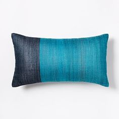 a blue and black striped pillow on a white background with the bottom half turned down