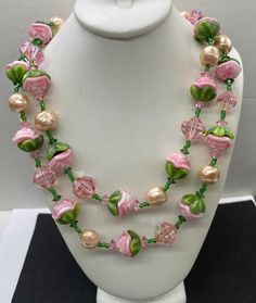 Beautiful Vintage Rare signed VENDOME Pink Gripoix Glass Flower and Pearl Crystal Double Strand Necklace measures 17" length adjustable. Vintage Pink Necklace With 17 Jewels, Vintage Pink Beaded Necklace As A Gift, Adjustable Glass Flower Jewelry, Adjustable Flower Glass Jewelry, Elegant Glass Flower Necklaces, Vintage Pink Flower Jewelry, Handmade Pink Nature-inspired Necklace, Elegant Glass Flower Necklace, Handmade Vintage Pink Necklace