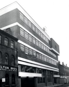 an old black and white photo of a building with the name nelson bros on it