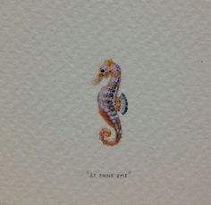 a watercolor drawing of a seahorse on white paper with the words sea shore written below it