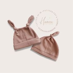 two baby hats with bows on them, one in pink and the other in brown