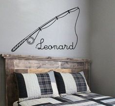 a wall decal that says lemonard on the side of a bed in a bedroom