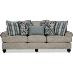 a gray couch with blue and white pillows