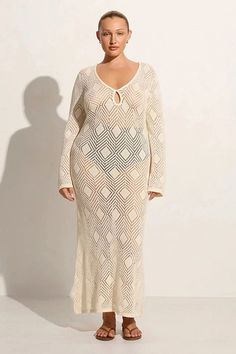 Embrace elegance with knitted V-neck long dress. This slim, long-sleeved maxi dress features a see-through hollow-out design, combining sophistication with modern allure, perfect for making a chic statement at any upscale event or formal gathering. Details: Elasticity: Slight Stretch Fabric Type: POLYESTER Silhouette: Sheath Neckline: V-Neck Material: POLYESTER Beige Long Sleeve Maxi Dress For Beach Cover-up, Chic V-neck Maxi Dress With Hollow Out, Long Hollow Out Dresses, Stretch Maxi Dress With Hollow Out Details, Chic V-neck Maxi Dress With Hollow Out Design, Chic V-neck Hollow Out Maxi Dress, Beige Long Sleeve Maxi Dress For Beach, Spring Hollow Out Long Maxi Dress, Spring V-neck Maxi Dress With Hollow Out Details