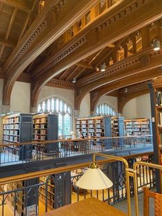 the inside of a library with many bookshelves