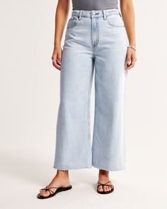 Our Curve Love high rise cropped wide leg jeans in a light wash with a raw-cut hem. This fit features a 10.5” high rise, is relaxed at the waist and hips, and eases into a wide, full-length leg shape with a cropped length. Our Curve Love styles add an additional 2” at the hip and thigh to allow room for your curves and eliminate waist gap. This jean is made from our super light drapey denim fabric, which features a super soft lightweight rigid denim. Cropped Wide Leg Jeans, Women's Bottoms, Denim Fabric, Cropped Jeans, Wide Leg Jeans, Leg Jeans, Fashion Forward, Womens Bottoms, Full Length