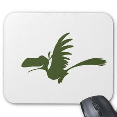 a computer mouse pad with a green bird on it's side and a black mouse next to it