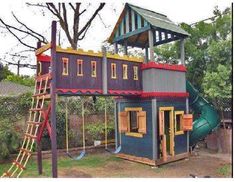 a children's play house with a slide and climbing frame in the back yard