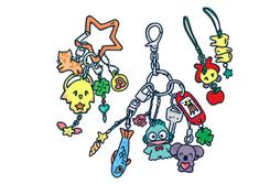 an assortment of cartoon keychains hanging on a white background with clippings