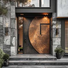 an entrance to a modern home with stone walls and large metal door, surrounded by potted plants