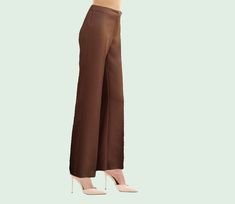 Express your femininity with our Crepe Pants: The refined elegance of the handmade Palazzo Pants. Perfect for any occasion, our Classic Mara Pant offers effortless style. Also available in plus sizes, ensuring uncompromising comfort and fashion. Rediscover the beauty of Italian craftsmanship with these unique and distinctive trousers. Women's crepe trousers in many colours, made in Italy. Very versatile trousers, the fluidity of the cadi combined with the essential shapes makes these trousers very comfortable and elegant. It is the classic item to pack for a business or leisure trip. Pair them with a loose shirt and you will get a comfortable outfit that can accompany you throughout the day until dinner. Cady trousers. Zip and hidden button closure. Adjustable high waist with strap. Comfor Luxury Brown Full-length Dress Pants, Pants Elegant, Crepe Trousers, Crepe Pants, Italian Craftsmanship, Loose Shirts, Plus Size Pants, Palazzo Pants, Fine Fabric