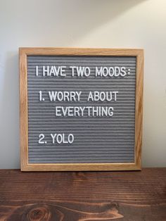 a sign that says i have two moodds 1 worry about everything 2 yolo