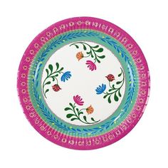 a pink and blue plate with flowers on the rim, decorated with floral designs in different colors