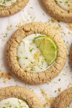 several cookies with limes and white icing on them