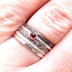 Garnet is the official birthstone for January. It is also the stone for the Zodiac sign Aquarius. Garnet's powers include healing, strength, and protection. This ring is handmade from 1.5mm sterling silver wire with a 3mm Garnet stone. The ring is perfect for stacking. Available in a shiny finish (Polished), or a matte finish (Brushed) or an oxidized and brushed finish (for a rustic look). The ring will be sent in a box, ready to be given as a gift. Made to order in your size within 3-5 business Garnet Ring As Gift With Round Band, Garnet Rings Gift Round Band, Garnet Ring With Round Band For Gift, Garnet Ring With Round Band As Gift, Garnet Birthstone Ring With Round Band As Gift, Garnet Birthstone Ring Gift, Adjustable Round Garnet Ring, Adjustable Garnet Ring, Garnet Birthstone Ring As A Gift